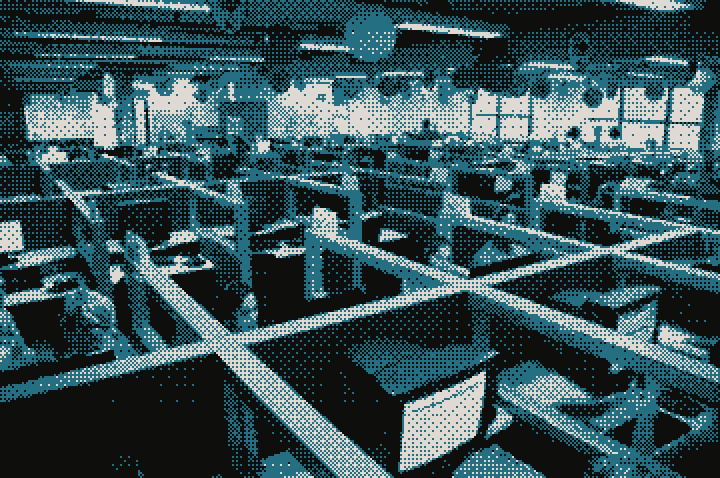 A sales floor of desks, people working the phones on headsets